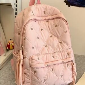 Pink Quilted Backpack with Bow Pattern